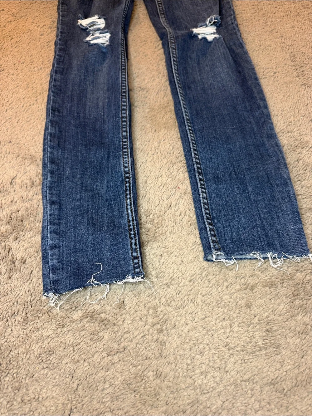 Free People indigo denim jeans with gold stitching